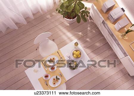 Stock Image - Dining table with two meals. Fotosearch