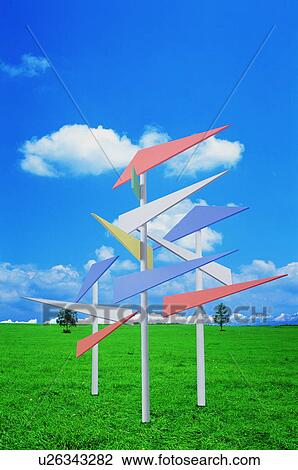 Stock Image - Directional arrows in a green field. Fotosearch