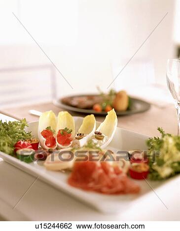 Stock Image - Dish with various appetizers. Fotosearch