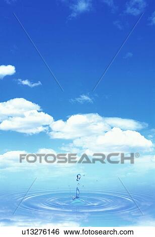 Droplet splashing into water under blue sky View Large Photo Image Stock Photograph - Droplet splashing into water under blue sky. Fotosearch
