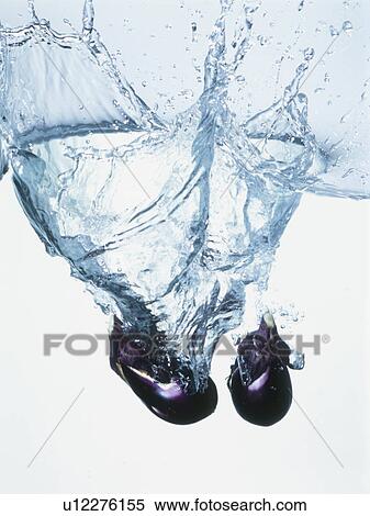 Eggplants falling into water View Large Photo Image Stock Photography - Eggplants falling into water. Fotosearch