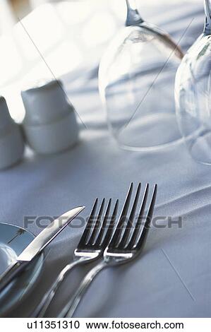 Empty glasses and silverware on table View Large Photo Image Stock Image - Empty glasses and silverware on table. Fotosearch