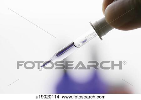 Picture - Eyedropper of aromatherapy oil. Fotosearch
