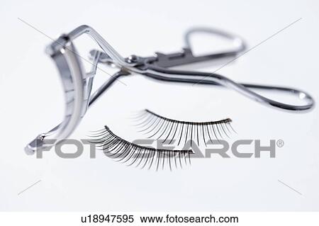 Stock Photography - Eyelash curler and false eyelashes. Fotosearch