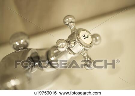 Stock Photograph - Faucet handle, close up. Fotosearch