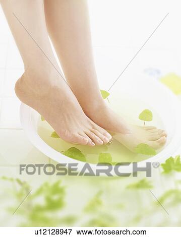 Stock Photo - Feet in a bowl of water. Fotosearch