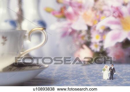 Figurines of bride and groom on table, close up, soft focus View Large Photo Image Stock Photo - Figurines of bride and groom on table, close up, soft focus. Fotosearch