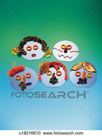 Stock Image - Five masks, colored background. Fotosearch