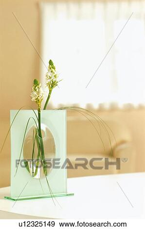 Stock Photo - Flower arrangement on table in house. Fotosearch