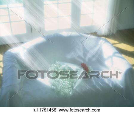 Stock Photo - Flower bouquet on sofa covered with sheet, computer graphic. Fotosearch