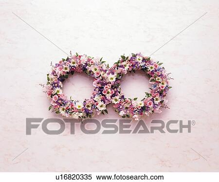 Flowers arranged in a figure eight View Large Photo Image Stock Photography - Flowers arranged in a figure eight. Fotosearch