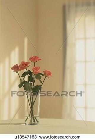 Stock Image - Flowers in a vase on a tabletop. Fotosearch
