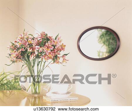 Stock Image - Flowers in a vase on a tabletop. Fotosearch