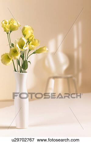 Stock Photo - Flowers in vase on table. Fotosearch