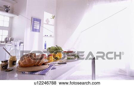 Stock Photo - Food arranged on kitchen counter. Fotosearch