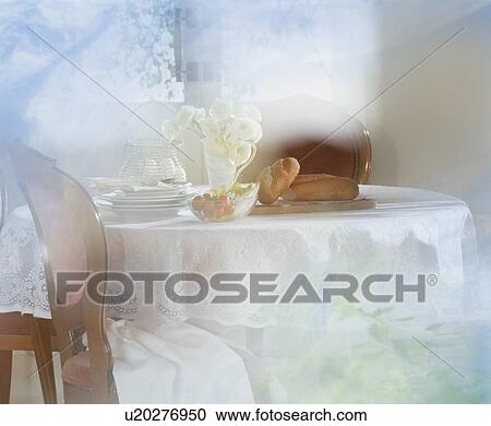 Stock Image - Food on table in soft white light. Fotosearch