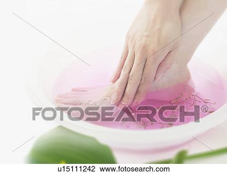 Foot in a bowl of water View Large Photo Image Stock Image - Foot in a bowl of water. Fotosearch