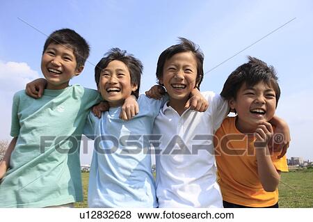Four boys laughing with arms around each other on field. Futako-tamagawa, Setagaya-ku, Tokyo Prefecture, Japan View Large Photo Image Stock Photo - Four boys laughing with arms around each other on field. Futako-tamagawa, Setagaya-ku, Tokyo Prefecture, Japan. Fotosearch