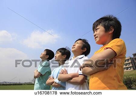 Four boys on field with arms crossed. Futako-tamagawa, Setagaya-ku, Tokyo Prefecture, Japan View Large Photo Image Stock Photo - Four boys on field with arms crossed. Futako-tamagawa, Setagaya-ku, Tokyo Prefecture, Japan. Fotosearch