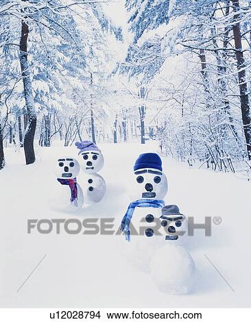 Four snowmen in a snowy forest View Large Photo Image Picture - Four snowmen in a snowy forest. Fotosearch