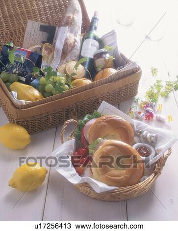 Stock Image - Fresh baked bagels and a picnic basket. Fotosearch