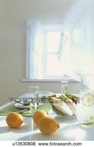 Stock Photo - Fresh fruit and salad on a kitchen countertop. Fotosearch