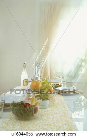 Stock Photography - Fresh fruit and salad on a kitchen countertop. Fotosearch