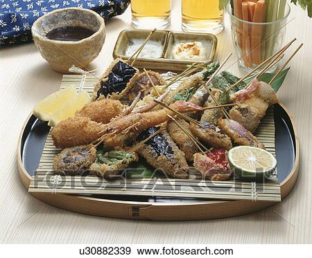Stock Photo - Fried vegetables and seafood. Fotosearch