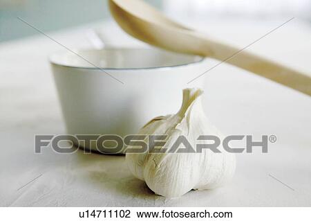 Garlic, pan and wooden spoon View Large Photo Image Stock Image - Garlic, pan and wooden spoon. Fotosearch