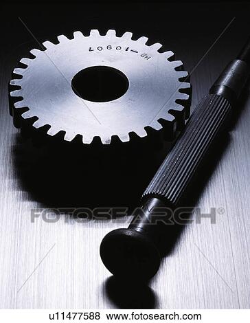 Stock Photo - Gear and a Nail. Fotosearch