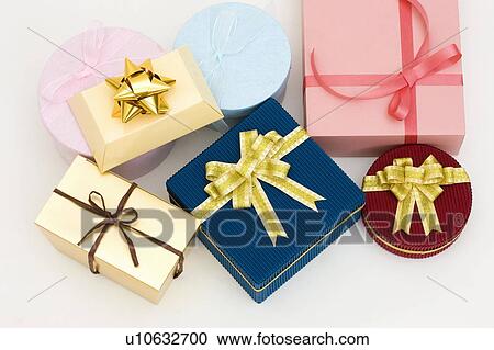 Stock Image - Gifts wrapped in different colors. Fotosearch