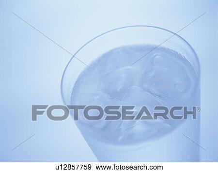Stock Photo - Glass of water, blue background. Fotosearch