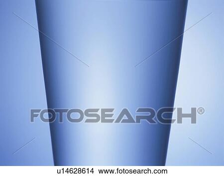 Picture - Glass of water, close up, blue background. Fotosearch