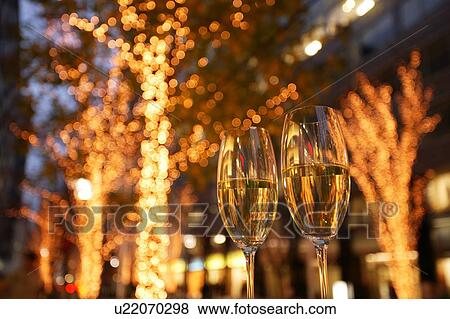 Stock Photo - Glasses of champagne, long exposure. Fotosearch