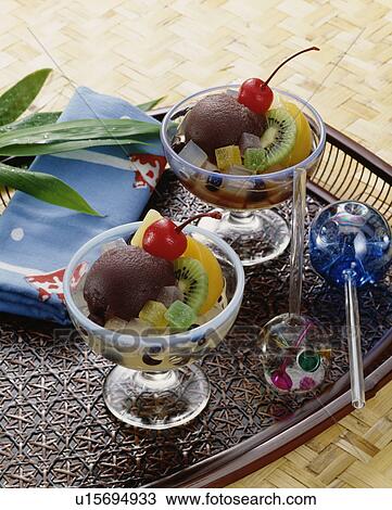 Stock Image - Glasses of sliced fruits and bean paste. Fotosearch