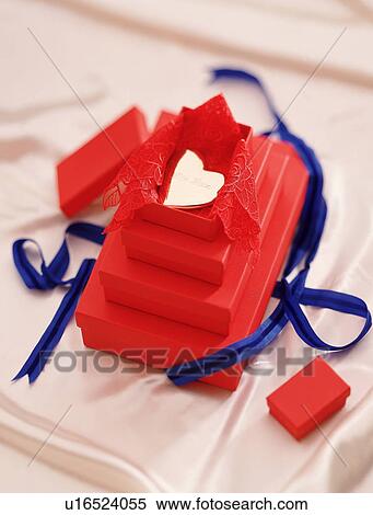 Stock Photography - Gold heart in a gift box. Fotosearch