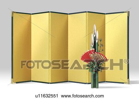 Stock Image - Golden folding screen and kadomatsu. Fotosearch