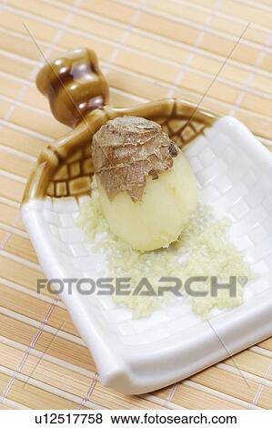 Grating ginger View Large Photo Image Stock Photo - Grating ginger. Fotosearch