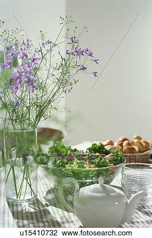Green salad and purple flowers on table View Large Photo Image Stock Image - Green salad and purple flowers on table. Fotosearch