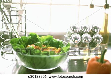 Green salad bowl on kitchen counter View Large Photo Image Stock Photography - Green salad bowl on kitchen counter. Fotosearch