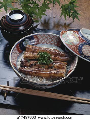 Stock Image - Grilled eel on rice in bowl. Fotosearch