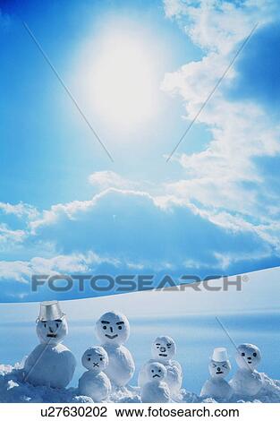 Stock Image - Group of snowmen in the winter sun. Fotosearch
