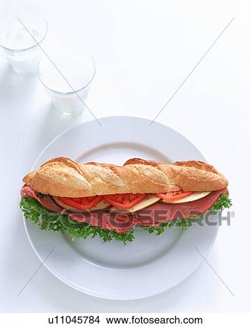 Picture - Ham, tomato and salad sandwich. Fotosearch