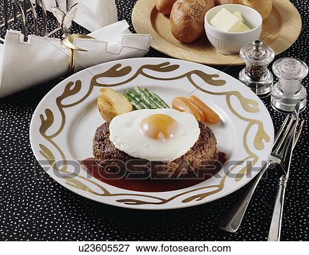 Stock Photo - Hamburger Stake with Eggs Sunny-side Up. Fotosearch