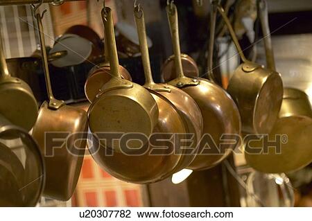 Stock Image - Hanging Pans in a Kitchen. Tokyo Prefecture, Japan. Fotosearch