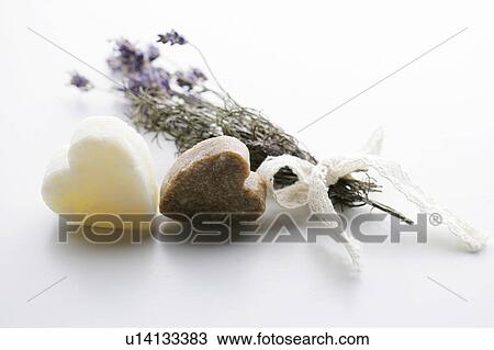 Stock Image - Heart shaped soaps and lavender bunch. Fotosearch