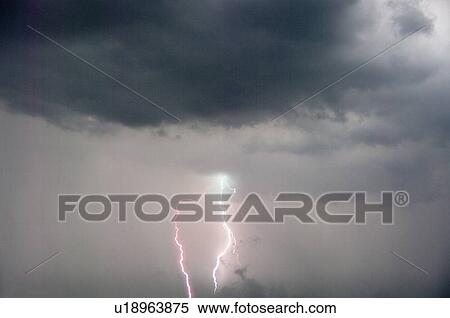 Stock Photography - Heavy Thunderclouds and Lightning . Fotosearch