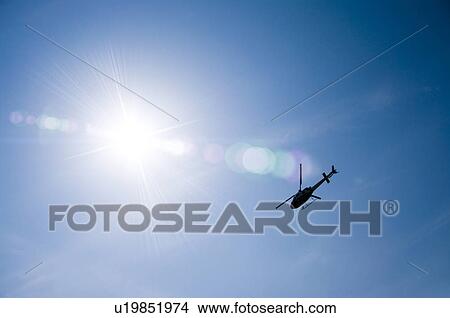 Picture - Helicopter in blue sky, Hitachinaka, Ibaraki Prefecture, Japan. Fotosearch