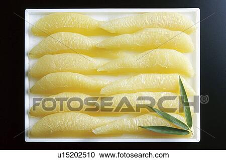 Stock Image - Herring roe, black background. Fotosearch
