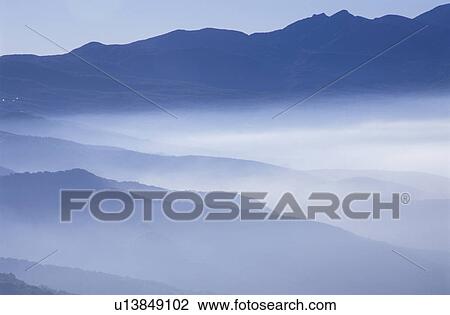 Stock Image - Higashiyama plateau in morning mist. Nagano Prefecture, Japan. Fotosearch